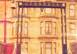 A photograph of the ornamental iron work at the entrance to Cessnock Subway Station - Glasgow