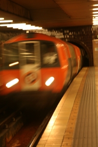 A slow shutter speed enhances the movement of a train arriving at Buchanan Street Station